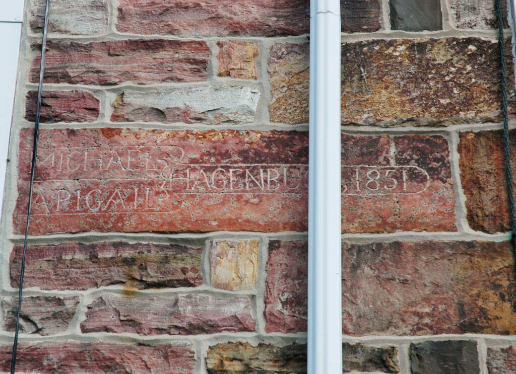 Michael and Abigail (Stapleton) Hagenbuch's names on bacon stone.