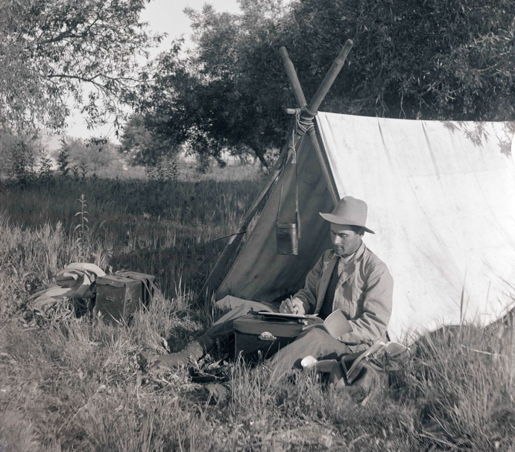 Klamath River Tent Man Writing Journal