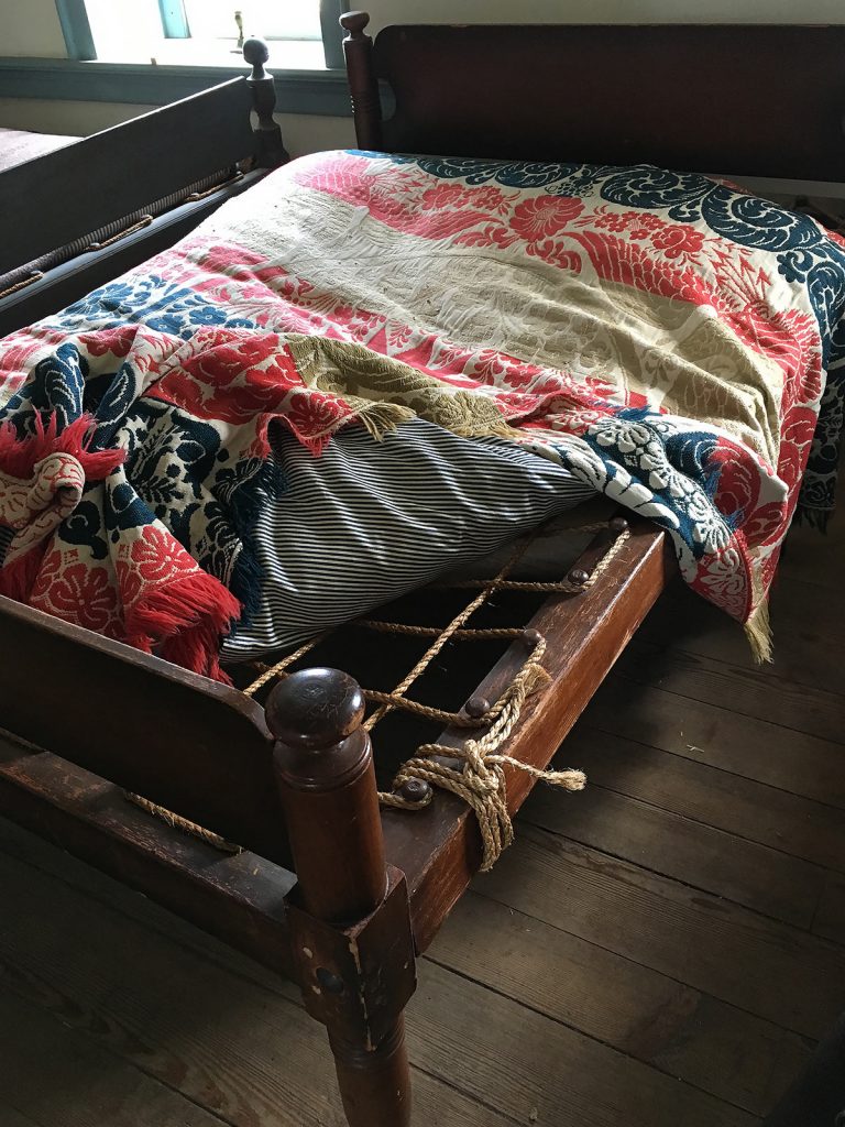 Double rope bed with coverlet