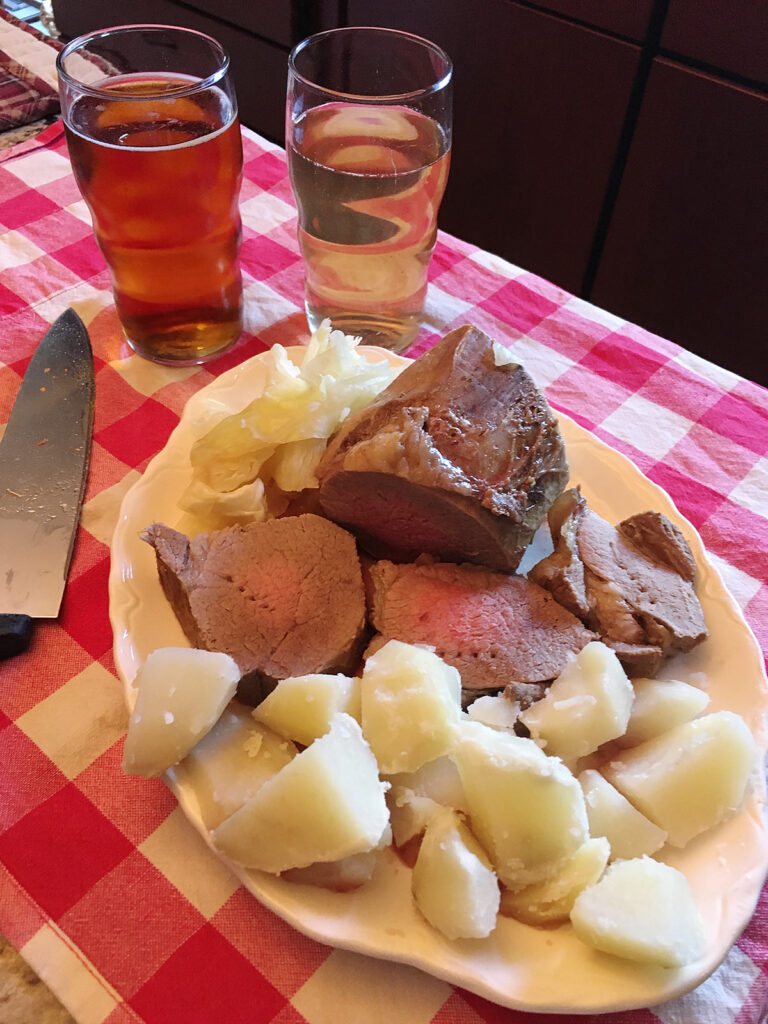 Boiled beef, potatoes, cabbage, and beer