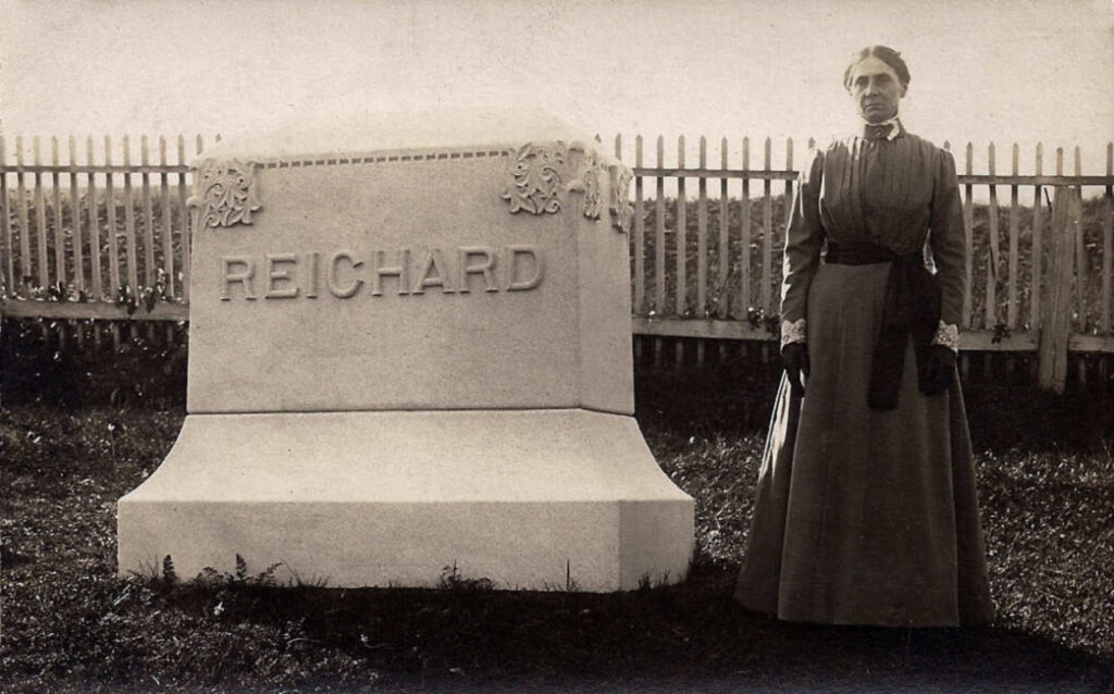 Clara (Hagenbuch) Reichard by her husband, James' grave, 1910.